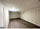 Basement with wood-look flooring and neutral walls at 668 Fielding Sw Ln, Atlanta, GA 30311