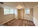 Finished basement featuring neutral walls, recessed lighting, carpet flooring, and natural light from two windows at 668 Fielding Sw Ln, Atlanta, GA 30311