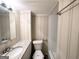 The bathroom features a granite countertop, and shower/tub combo at 668 Fielding Sw Ln, Atlanta, GA 30311
