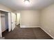 Bedroom featuring neutral walls, plush carpet, and a closet with open door at 668 Fielding Sw Ln, Atlanta, GA 30311