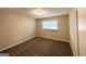 Bedroom with neutral walls, plush carpet and window letting in natural light at 668 Fielding Sw Ln, Atlanta, GA 30311