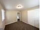 Bedroom with neutral walls and plush carpet and a closet at 668 Fielding Sw Ln, Atlanta, GA 30311