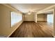Bright living space featuring hardwood floors, neutral paint, a ceiling fan, and a glimpse into the dining area at 668 Fielding Sw Ln, Atlanta, GA 30311