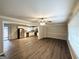 Inviting open-concept living area featuring hardwood floors, lots of natural light, and a clear view into the kitchen at 668 Fielding Sw Ln, Atlanta, GA 30311