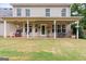 Spacious backyard with a covered patio and room for entertaining at 220 Calli Ct, Mcdonough, GA 30252