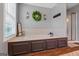 Bathroom with a soaking tub, tile surround, and decorative wreath on the wall at 220 Calli Ct, Mcdonough, GA 30252
