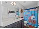Bathroom with a pirate themed shower curtain and sink vanity at 220 Calli Ct, Mcdonough, GA 30252