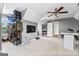 Bonus room with large television, ceiling fan, and play area at 220 Calli Ct, Mcdonough, GA 30252