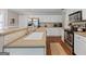 Bright kitchen showcasing a spacious countertop, modern appliances, and white cabinetry at 220 Calli Ct, Mcdonough, GA 30252