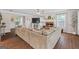 Cozy living room with a fireplace, plush sofa, and abundant natural light at 220 Calli Ct, Mcdonough, GA 30252