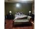 The bedroom is furnished with a bed, chaise lounge and television stand, offering a cozy retreat at 472 Harvick Cir, Stockbridge, GA 30281