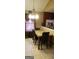 A dining area featuring a decorative chandelier and a dining table with leather chairs at 472 Harvick Cir, Stockbridge, GA 30281