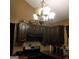 A kitchen featuring dark wood cabinets, a gas range, and dark countertops at 472 Harvick Cir, Stockbridge, GA 30281