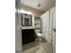 Compact bathroom with a vanity, toilet, and shower featuring a butterfly-themed curtain at 5363 Forest Dr, Loganville, GA 30052