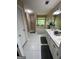 Bathroom featuring a dual sink vanity, jacuzzi tub and a shower with glass doors at 5363 Forest Dr, Loganville, GA 30052