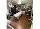 Eclectic bedroom featuring a ceiling fan, hardwood floors, and ample decor at 5363 Forest Dr, Loganville, GA 30052
