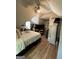 Sloped ceiling bedroom featuring a comfy bed, closet storage, and natural light at 5363 Forest Dr, Loganville, GA 30052