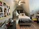 Sloped ceiling bedroom with a comfy bed and decorative items creating a personalized space at 5363 Forest Dr, Loganville, GA 30052