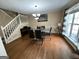 Bright dining room with hardwood floors, large window, and stylish furniture, perfect for entertaining at 5363 Forest Dr, Loganville, GA 30052