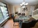 Dining room featuring a glass table, modern chairs, hardwood floors, and a view into other rooms at 5363 Forest Dr, Loganville, GA 30052