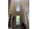 Welcoming entryway features a high ceiling, window, front door with decorative glass, and neutral decor at 5363 Forest Dr, Loganville, GA 30052