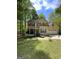Charming two-story home featuring a front porch, attached garage, and well-maintained front yard at 5363 Forest Dr, Loganville, GA 30052