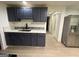 Well-lit kitchen featuring stainless steel refrigerator and modern backsplash at 5363 Forest Dr, Loganville, GA 30052