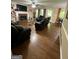 Living room showcasing a fireplace and open access to the kitchen at 5363 Forest Dr, Loganville, GA 30052