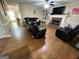 Living room featuring a brick fireplace and ample seating at 5363 Forest Dr, Loganville, GA 30052