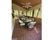 Covered porch with screened-in windows, a ceiling fan and outdoor furniture at 5363 Forest Dr, Loganville, GA 30052