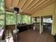 Outdoor living area on a covered porch, complete with a grill and heater at 5363 Forest Dr, Loganville, GA 30052