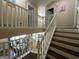 View of a staircase with white railings leading upstairs at 5363 Forest Dr, Loganville, GA 30052
