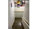 Interior stairway featuring hardwood steps and white wall art at 5363 Forest Dr, Loganville, GA 30052