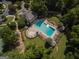 Overhead of community pool and clubhouse surrounded by landscaped grounds with seating for relaxation at 100 Trotters Rdg, Fayetteville, GA 30215
