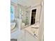 Luxurious bathroom with a glass-enclosed shower and dual vanity sinks, and a walk-in closet at 100 Trotters Rdg, Fayetteville, GA 30215