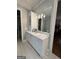 Elegant bathroom with dual sinks, granite countertops, and modern lighting fixtures at 100 Trotters Rdg, Fayetteville, GA 30215