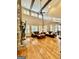 Bright, spacious living room with a stone fireplace, hardwood floors, and lots of natural light at 100 Trotters Rdg, Fayetteville, GA 30215
