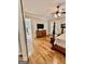 Spacious main bedroom with hardwood floors, leading to a luxurious bathroom with a soaking tub at 100 Trotters Rdg, Fayetteville, GA 30215