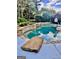 Inviting swimming pool surrounded by lush greenery and landscaping at 100 Trotters Rdg, Fayetteville, GA 30215