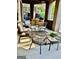 The inviting porch features multiple seating options and a summer kitchen with a grill at 100 Trotters Rdg, Fayetteville, GA 30215