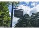 A view of the Highgrove neighborhood sign established in 1996, surrounded by trees at 100 Trotters Rdg, Fayetteville, GA 30215