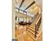 Entryway showcasing hardwood staircase leading to living room with stone fireplace at 100 Trotters Rdg, Fayetteville, GA 30215