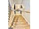 View of wooden staircase with black metal railings leading down to the first floor at 100 Trotters Rdg, Fayetteville, GA 30215