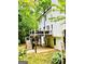 Multi-level backyard with a deck, patio, and lush greenery, perfect for outdoor living at 2870 Willow Wisp Way, Cumming, GA 30040