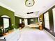 Spacious bedroom features tray ceilings, a ceiling fan, and large windows offering plenty of natural light at 2870 Willow Wisp Way, Cumming, GA 30040