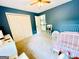 This bedroom includes a closet and a ladder to get to the upper floor at 2870 Willow Wisp Way, Cumming, GA 30040