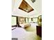Spacious bedroom features tray ceilings, a ceiling fan, and large windows offering plenty of natural light at 2870 Willow Wisp Way, Cumming, GA 30040
