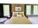 The bedroom features large windows, hardwood floors, and modern decor, creating a cozy and stylish space at 2870 Willow Wisp Way, Cumming, GA 30040