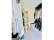 An organized walk-in closet features shelves, hanging rods, and a mirrored door for efficient storage at 2870 Willow Wisp Way, Cumming, GA 30040