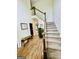 Inviting foyer with hardwood floors, staircase, and natural light, creating a warm and welcoming entrance at 2870 Willow Wisp Way, Cumming, GA 30040